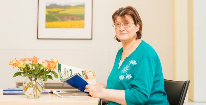 inpatient is reading a magazin in one of the restrooms