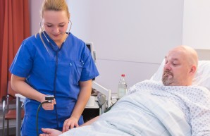 a nurse check blood pressure